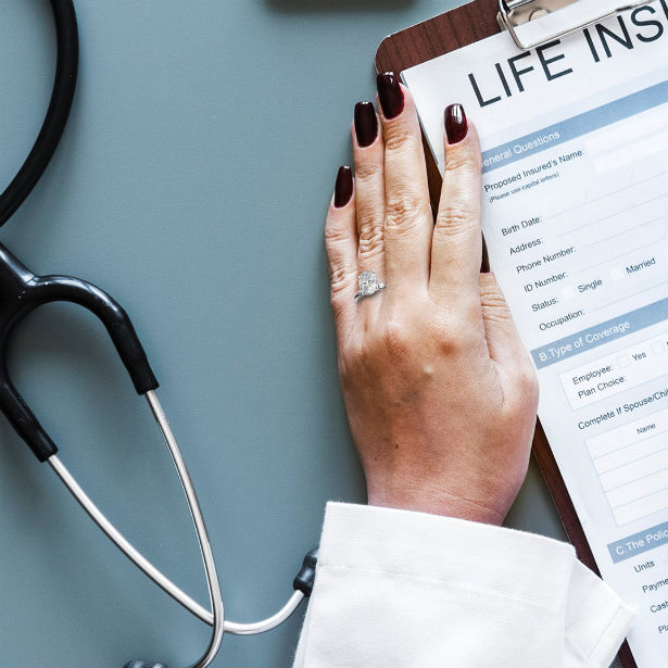 woman filling out form wearing good engagement ring for doctors