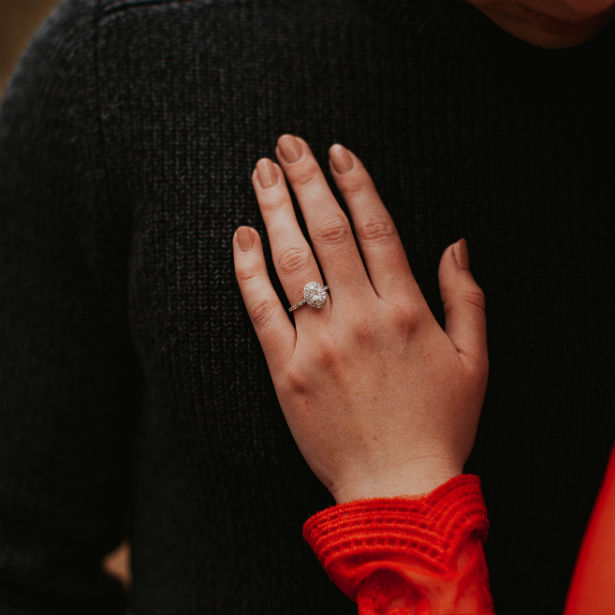 woman's hand wearing ring with russian diamonds