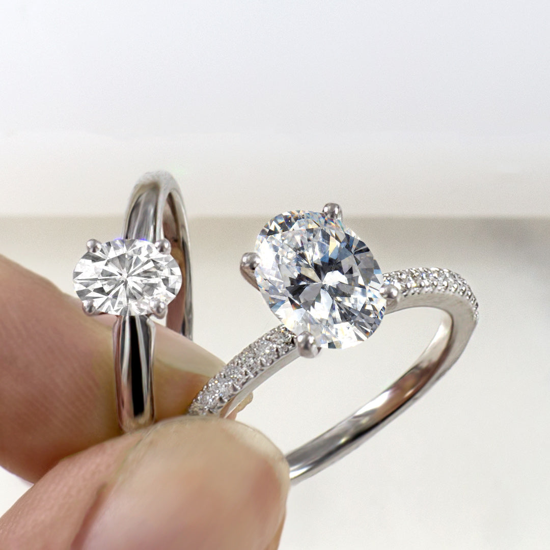 Four prong oval moissanite solitaire white gold ring & oval pave moissanite white gold ring