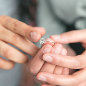 couple admiring engagement ring size
