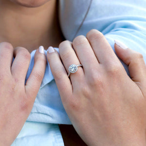 woman holding man's arm wearing a ring with a pave setting