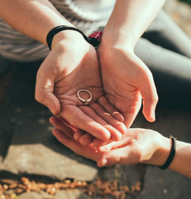 woman holding ring with rose cut diamond